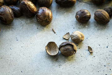 Cut nutmeg pile on a concrete table 