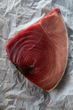 Slice of tuna on baking paper