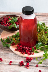 Cranberries and cranberry juice in a plastic bottle