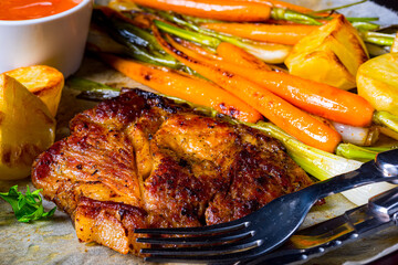 grilled neck chops with caramelized vegetables.