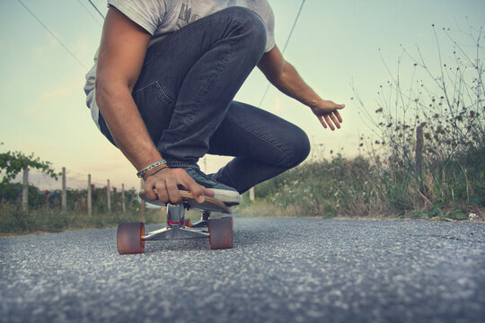 A young man with his longboard