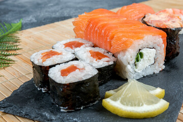 Sushi set. Japanese sushi, rolls, soy sauce, ginger, chopsticks