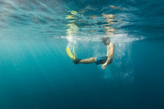Man having fun while snorkeling in the ocean