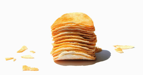 potato chips tower  and crumbs isolated on white background. snack