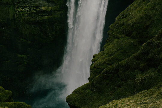 waterfall with lush greenery on a mountain