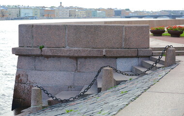 Granite steps of descent to the water with cast-iron chains, Universitetskaya embankment, Saint...