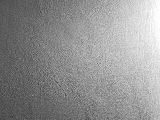 Grey concrete wall background with texture and natural light.