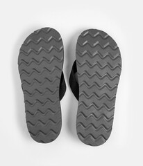Pair of black rubber sole flip-flops isolated on white background