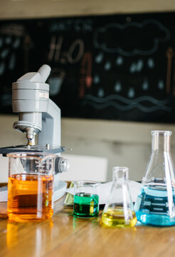 Microscope and lab glassware in a school classroom