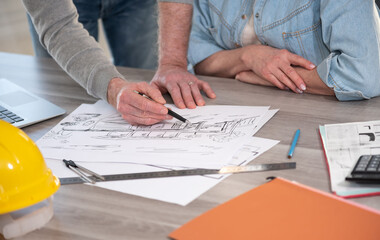 Architects working on house sketch