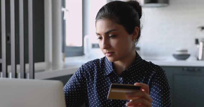 On-line e payment fraud or fail, credit card data theft, lack of money, insufficient funds overspend concept. Irritated young indian female sit indoors try make purchase on internet having problems