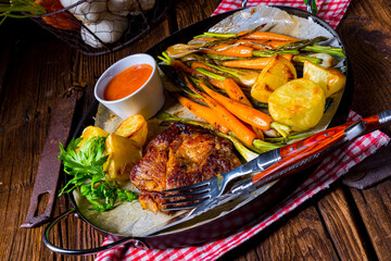 grilled neck chops with caramelized vegetables.