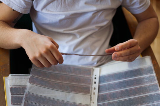 Male hands holding a film roll