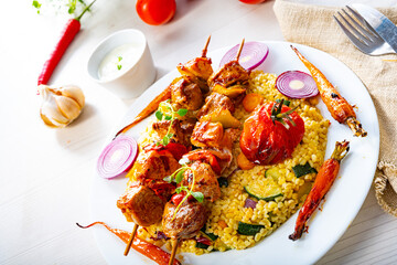 Shish kebabs with vegetables and bulgur