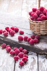 Fresh ripe organic raspberry on a wooden background, copy space.