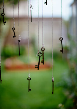 Antique keys hanging outdoors.