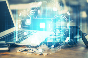 Computer on desktop with social network hologram. Multi exposure. Concept of international people connections.