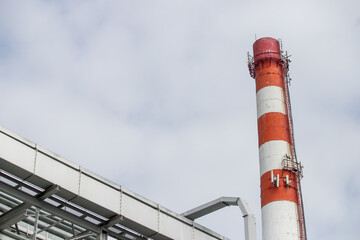 Territory of thermal power plant, red pipes, industrial buildings