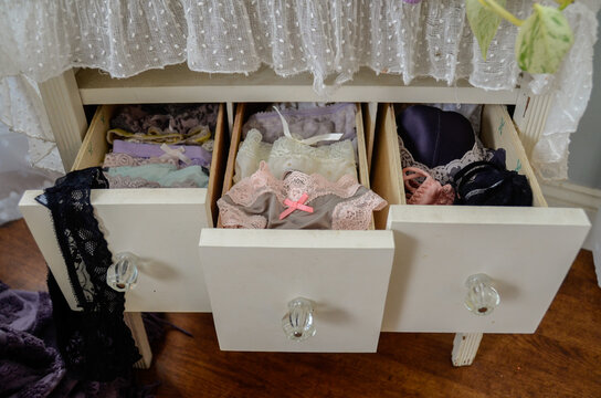 females dresser drawers pulled out exposing her panties and underwear