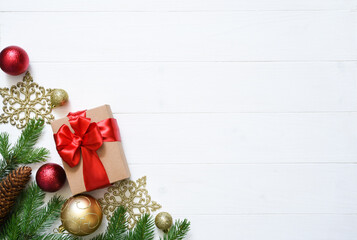 Christmas white background with fir, gifts and decor. Top view with space for copy.