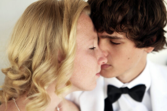 Couple Dressed In Formal Attire Faces Close Together