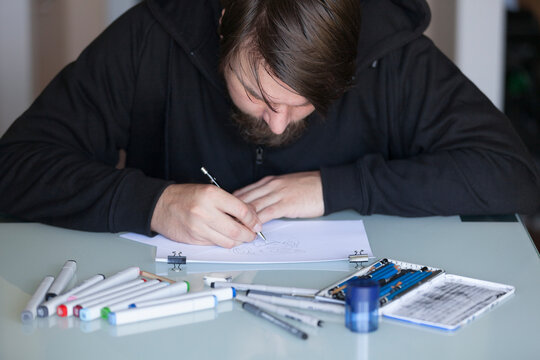 Man drawing on table