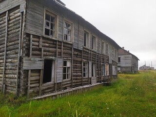 Fototapeta na wymiar Old ruined abandoned wooden houses