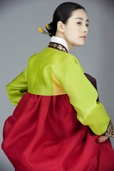 young woman in korean traditional clothing, hanbok
