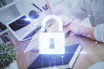 Double exposure of woman's hands writing with lock icon. Concept of security and protection of data