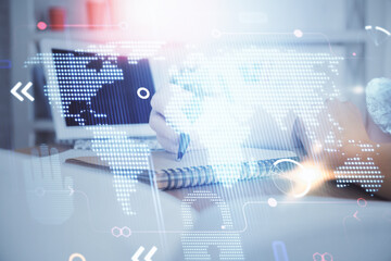 Fototapeta premium Double exposure of hands making notes with world map hologram and data theme icons. Concept of international network data.