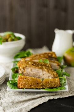 Roast pork belly joint with crackling for dinner