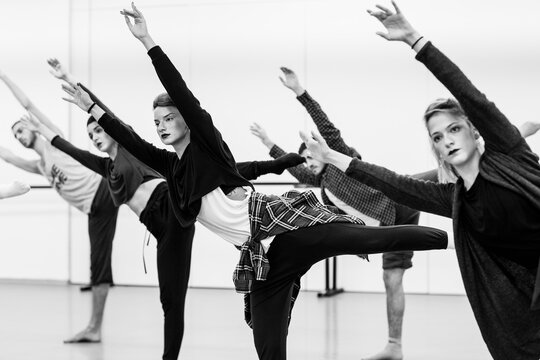 Dancers stretching before doing their dance routine