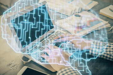 Man typing on keyboard background with brain hologram. Concept of big Data.