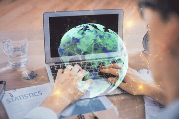 Social network theme hologram with businessman working on computer on background. Concept of world wide web. Double exposure.