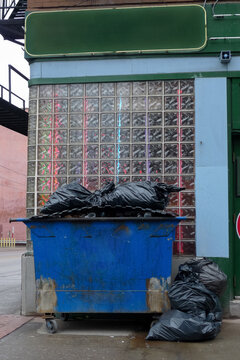 Dumpster Overflowing with Trash