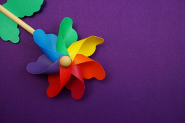 colorful pinwheel with space copy isolated on purple background