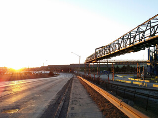 Empty Road and Bankrupt Closed Steel Mill Factory in Industrial Area