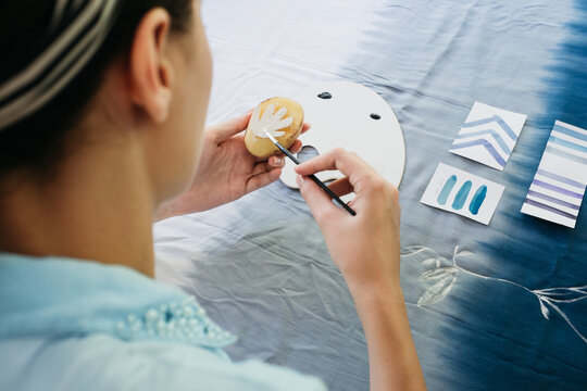 Female Artist Making Textile Print Using Potato Stamps