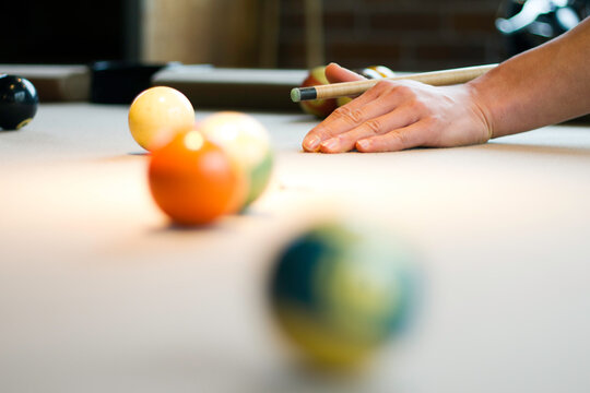 Man Shooting Pool.