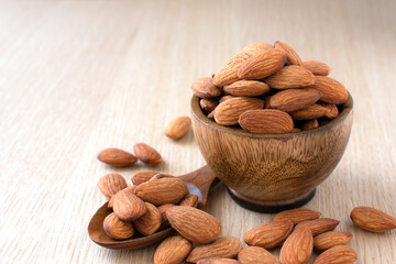 Almonds on the wood background,copy space.