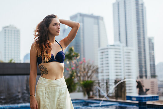 Beautiful woman relaxing at a pool