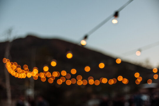 Decorative rows of lights at wedding reception