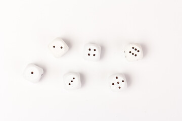 White gamble dice with black dots, isolated on white background.