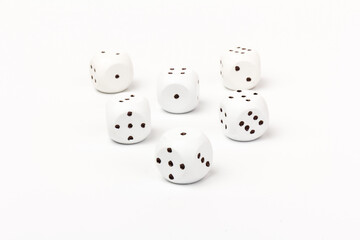 White gamble dice with black dots, isolated on white background.