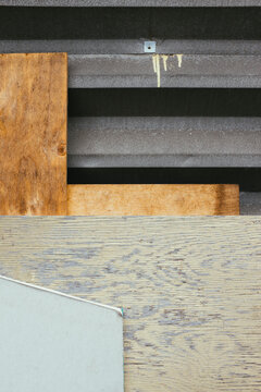 Pieces of discarded plywood and drywall