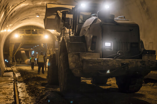 bulldozer in a tunnel, working atmosphere