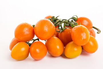Golden yellow tomatoes on white background