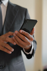 businessman hand holding smartphone