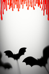 Halloween Decoration. Terrifying Shadow Puppets. Shadows bats and blood drops on the gray...