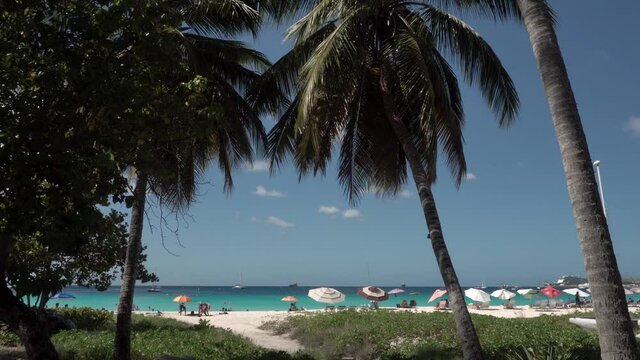 Bridgetown / Barbados - December 2019: Tourists relaxing on a public beach.
